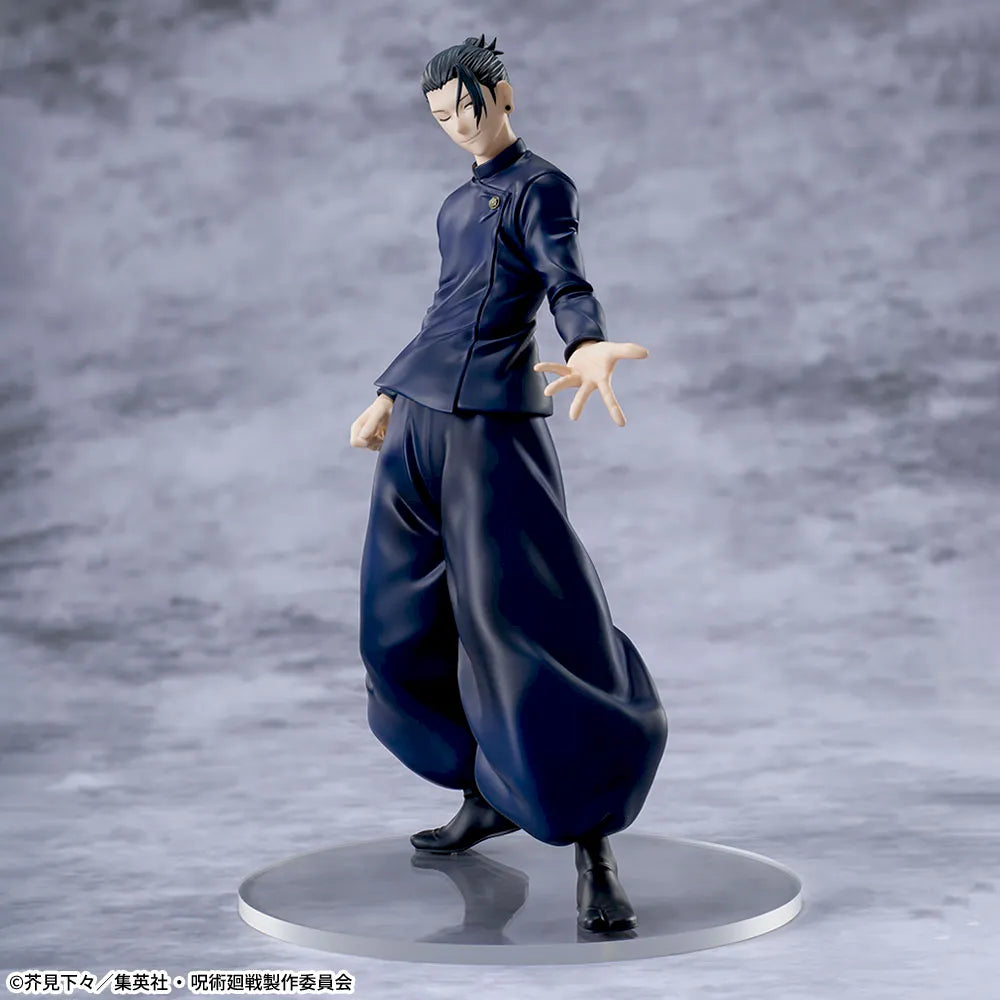Figure of a character in a dark outfit on a gray background