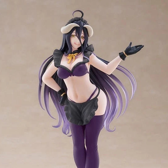 An anime-style female figurine with long dark purple hair, wearing a black and purple outfit with a small horned headpiece, posed against a plain beige studio background.