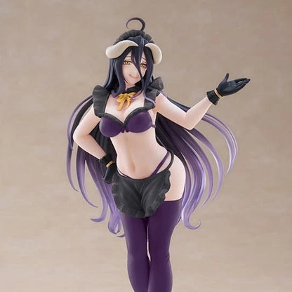An anime-style female figurine with long dark purple hair, wearing a black and purple outfit with a small horned headpiece, posed against a plain beige studio background.