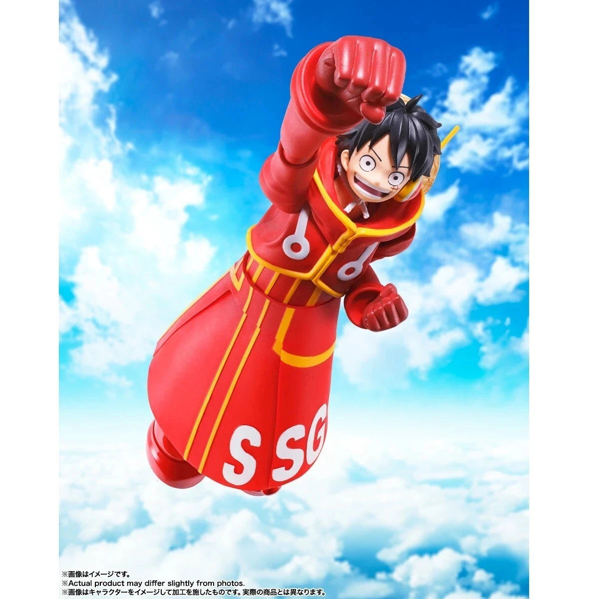 A collectible action figure of SLuffy from One Piece floating against a bright blue sky with white clouds. The figure is wearing his signature red and yellow SSG uniform and has 'SSG' printed on the side.