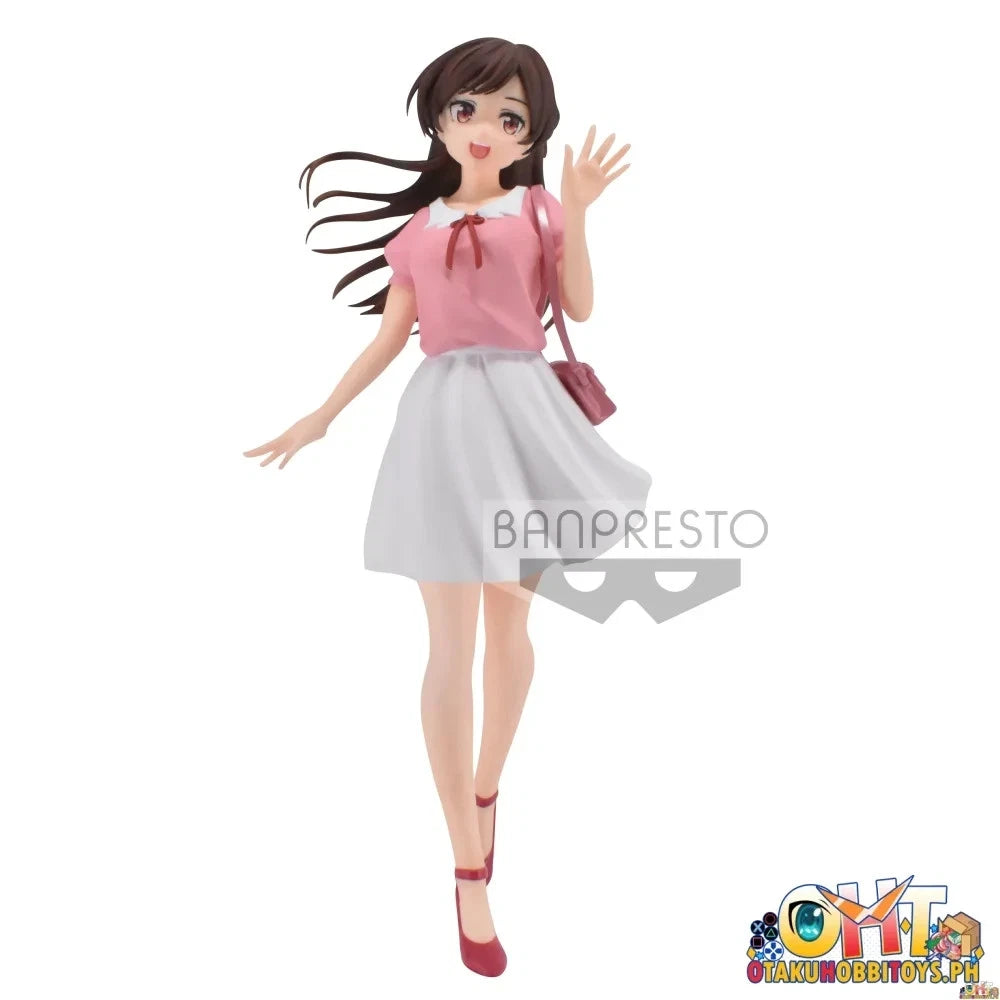 A Banpresto anime figurine of a female character with long dark brown hair, wearing a pink top, white skirt, and red shoes, waving on a plain white background.