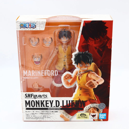 SH Figuarts Monkey D. Luffy Marineford action figure in its original packaging, featuring multiple interchangeable heads and accessories, with anime artwork on the box.