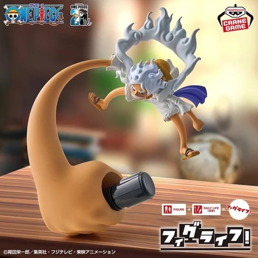Figurine of a character with white hair and blue clothing on a large pipe, with logos and text in the corners.