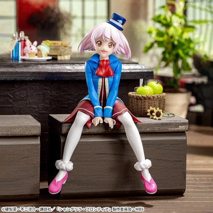 A detailed anime figurine of a girl with pink hair sitting on a wooden chest in a room setting, wearing a blue and red outfit with white stockings and pink shoes.